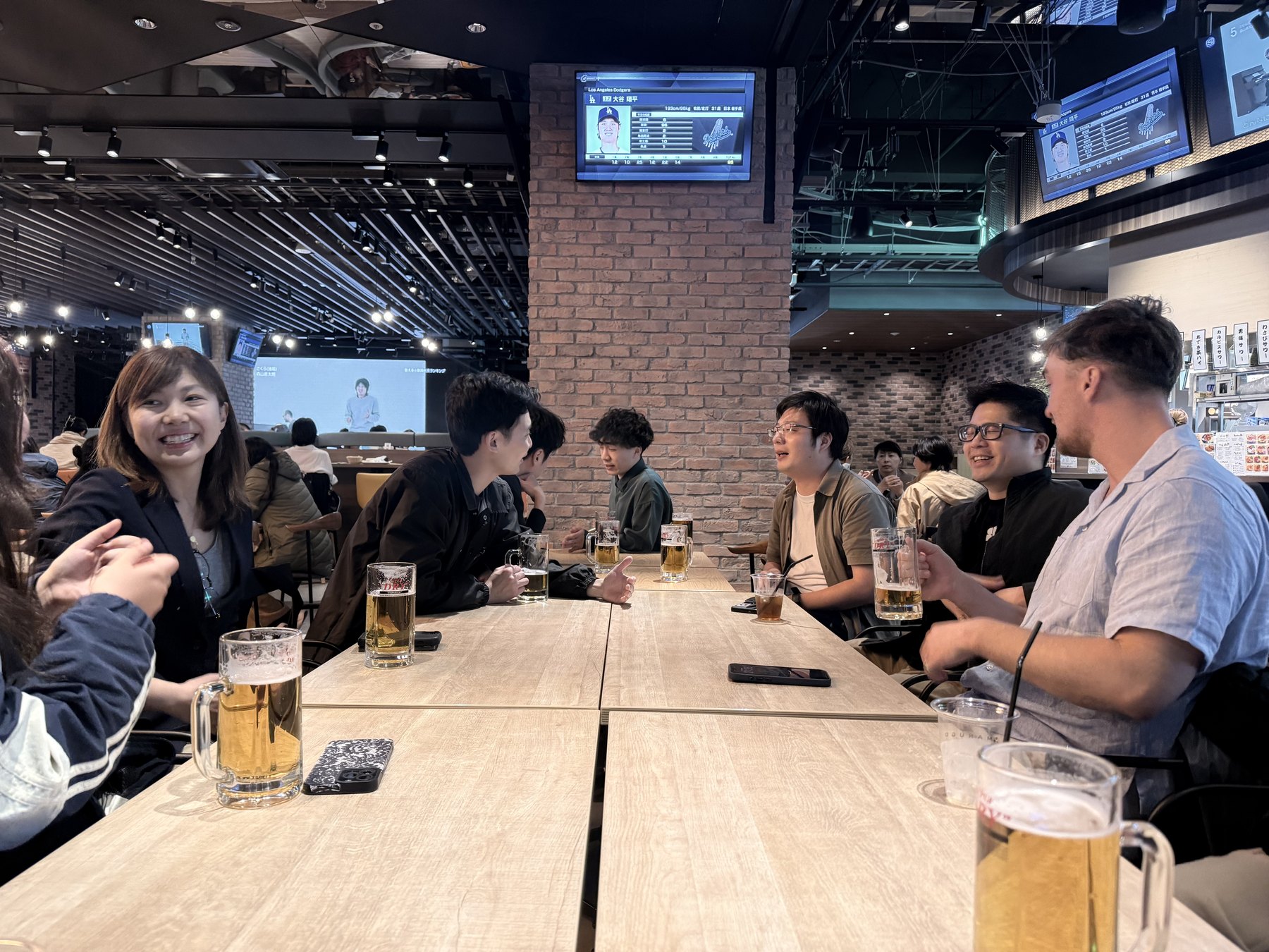 OpenDome founders gathered around a table during a social event